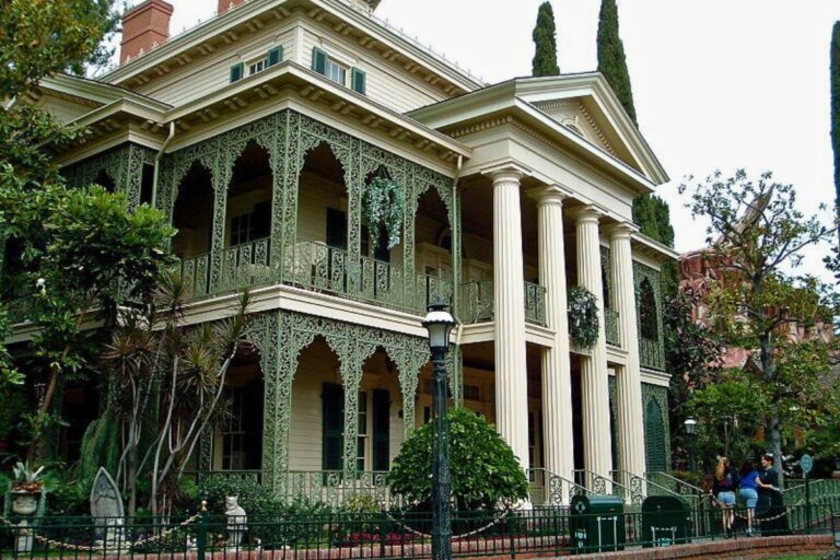 Disneyland's haunted mansion, an iconic spooky attraction with intricate details and a mysterious aura, inviting brave visitors.